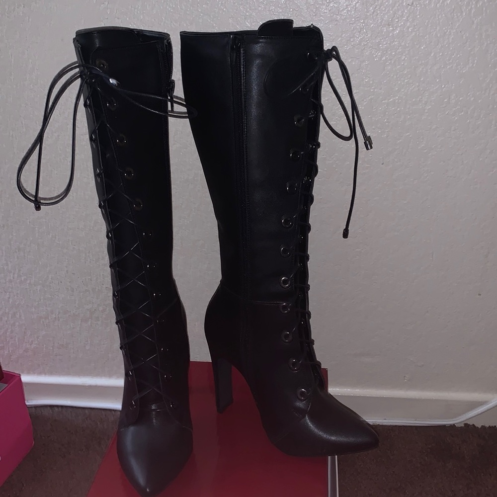 Never wore size 6 1/2 black heels boots